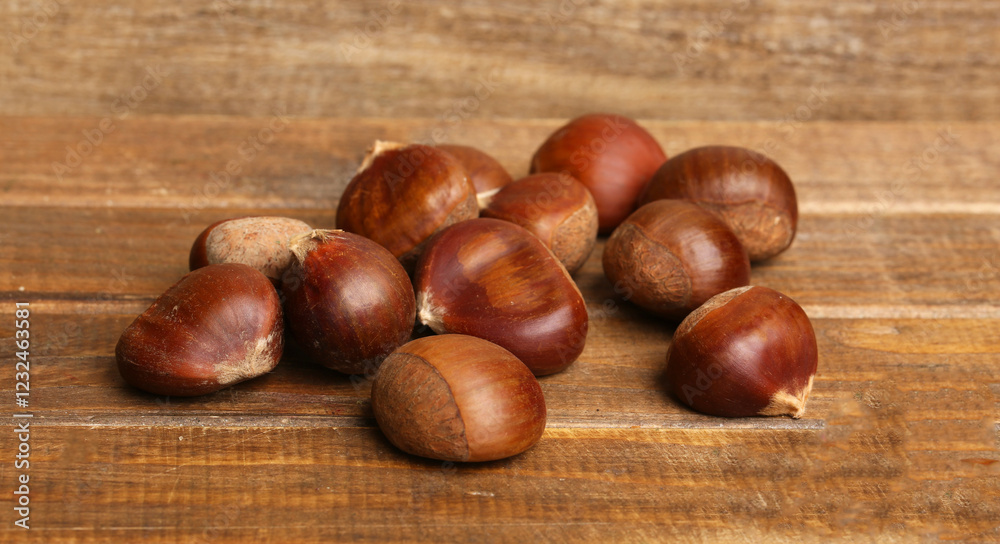 set of chestnuts on a rustic background set of chestnuts on a rustic background