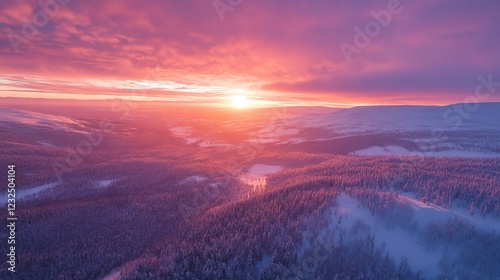 Stunning winter scene of Lapland from above, bathed in sunset hues. photo