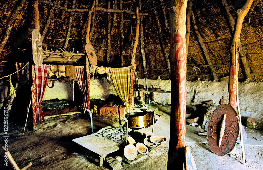 Celtic Iron Age roundhouse reconstructed on original foundations at Castell Henllys archaeological site, Pembrokeshire, Wales UK