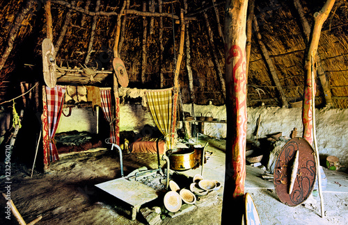 Obraz na płótnie Celtic Iron Age roundhouse reconstructed on original foundations at Castell Henllys archaeological site, Pembrokeshire, Wales UK w salonie