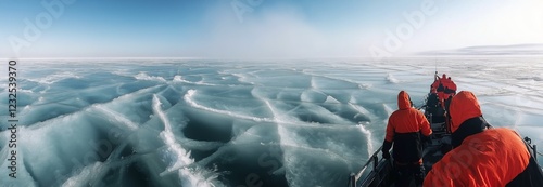 Exploring ice formations during an Arctic expedition on a clear day with rese...