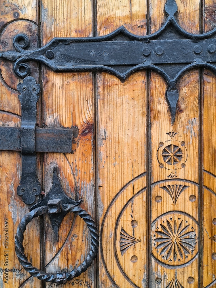 old wooden door with black metal rings old wooden door with black metal rings