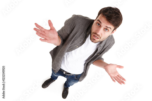 Clueless man, portrait and shrug with question for doubt, uncertainty or choice above on a white studio background. Top view, male person or puzzled model with hands out for confusion or unknown