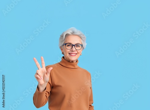 an image of a woman with glasses making a peace sign. photo