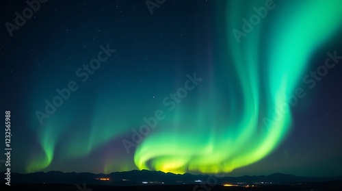 Vibrant northern lights dancing over a peaceful winter landscape photo