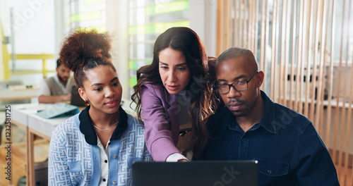 Business people, coaching and pointing with laptop for software training, update or learning best practice at office. Female person, employee or showing team work with computer for staff supervision