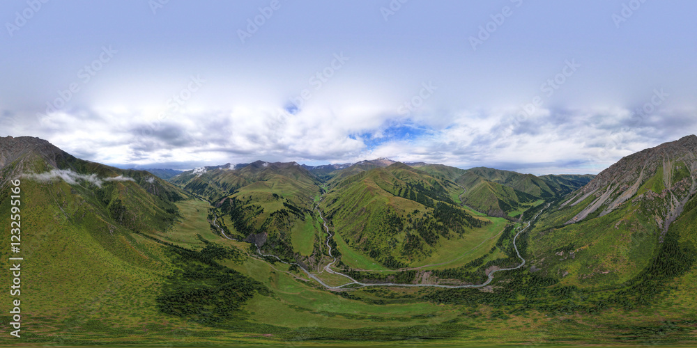 360 panorama of a mountainous area from a height. Drone view of green meadows and hills, with coniferous trees in places. A river runs through the forest. White clouds and blue sky. Beautiful gorge.
