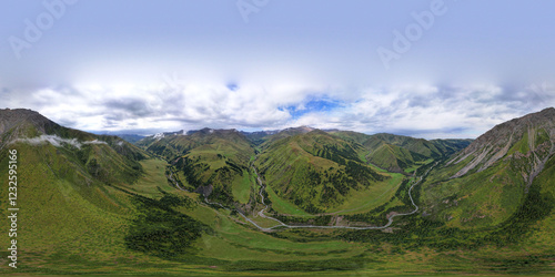 Obraz na płótnie 360 panorama of a mountainous area from a height. Drone view of green meadows and hills, with coniferous trees in places. A river runs through the forest. White clouds and blue sky. Beautiful gorge. w salonie