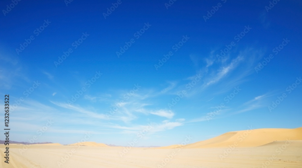 Fototapeta premium Vast Desert Landscape Under a Blue Sky