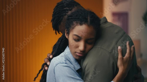 Wife embraces her husband after a fight, restoring trust in their relationship