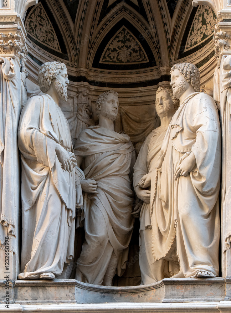 Fototapeta premium The group of the Four Crowned Saints and are Casorio, Claudio, Sempronio and Nicostrato, 1409 - 1417 by Nanni di Banco in the external niches of the church of Orsanmichele in Florence, Italy.