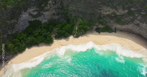 Kelingking beach cliff Nusa Penida sandy coast Bali aerial drone shot photo