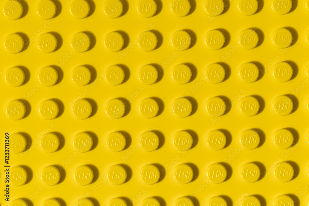 Fototapeta premium Yellow background of the LEGO Classic plate