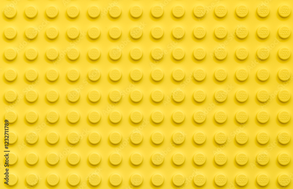 Fototapeta premium Yellow background of the LEGO Classic plate