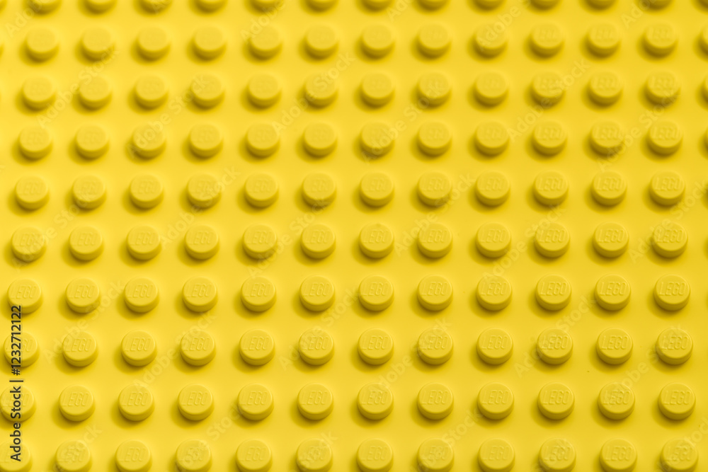 Fototapeta premium Yellow background of the LEGO Classic plate
