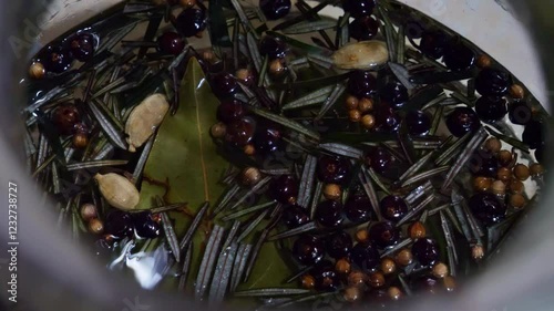 Close-Up of Botanicals Infusing in Gin