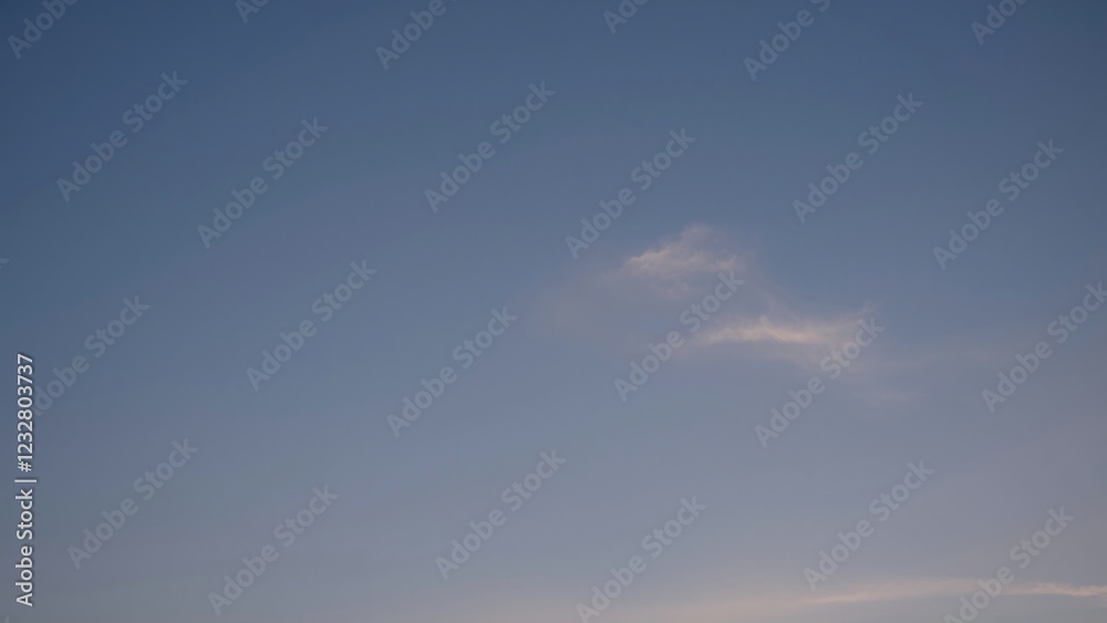 Serene Blue Sky with Wispy Cloud Formation Serene Blue Sky with Wispy Cloud Formation
