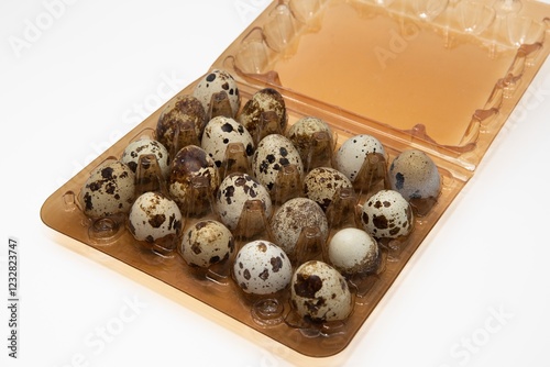 Quail Eggs in a Plastic Container – Fresh Organic Farm Product photo