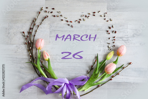 Calendar for March 26: numbers 26, name of the month March in English in a heart of flowers photo