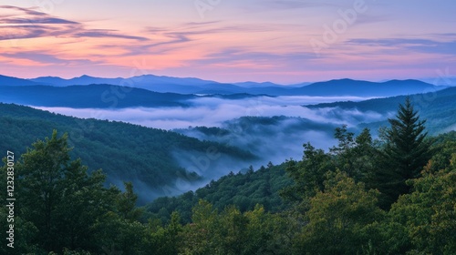 Serene Mountain Landscape with Fog and Colorful Sunrise Sky