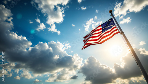 A vibrant American flag, a symbol of freedom and patriotism, billows in the wind against a backdrop of a breathtaking blue sky.