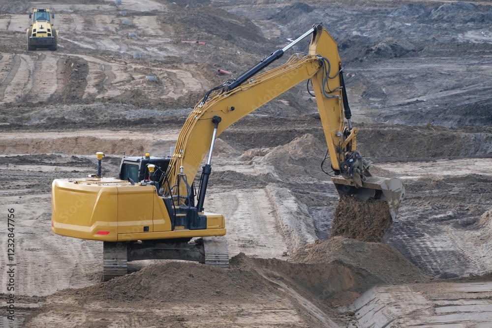 Working excavator on construction site while building highway