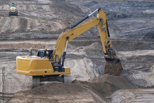 Obraz na płótnie Working excavator on construction site while building highway w salonie