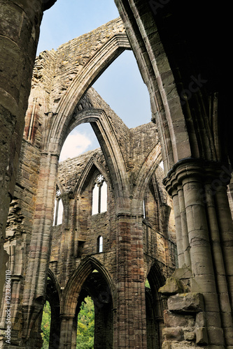 Tintern Abbey in the Wye Valley, Monmouthshire, Wales, UK. Cistercian Christian monastery founded 1131. Central transept arches