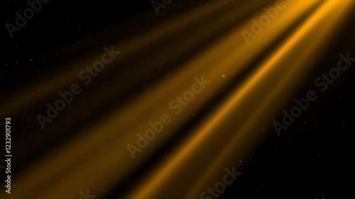 Warm rays of light on a black background with flickering particles.