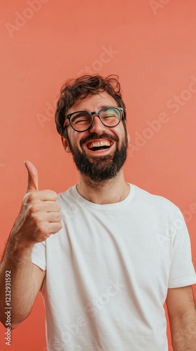 Smiling man giving thumbs up in a casual setting with a plaid shirt