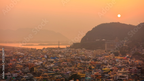 Fototapeta Naklejka Na Ścianę i Meble -  Panoramic aerial view of city in twilight, at Vijayawada, India