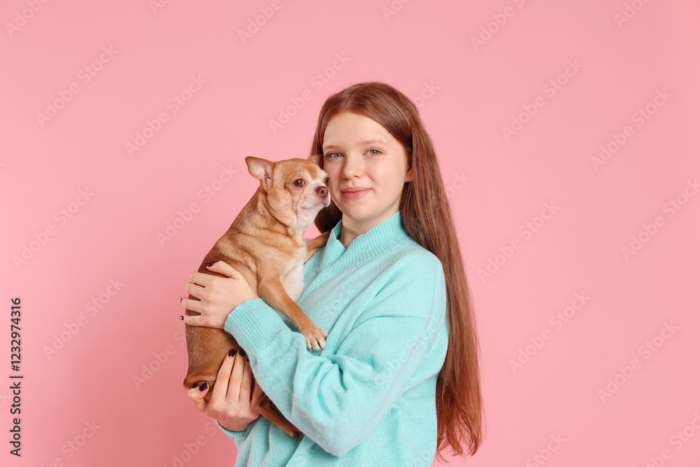 Teenage girl with her cute Chihuahua dog on pink background Teenage girl with her cute Chihuahua dog on pink background