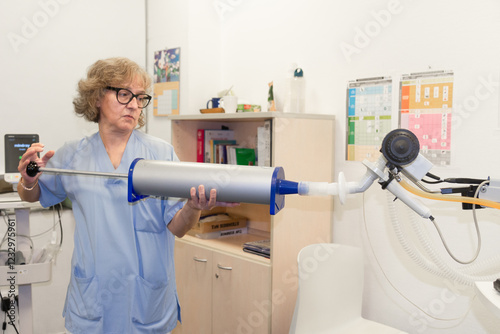 Female medical professional conducting spirometry test