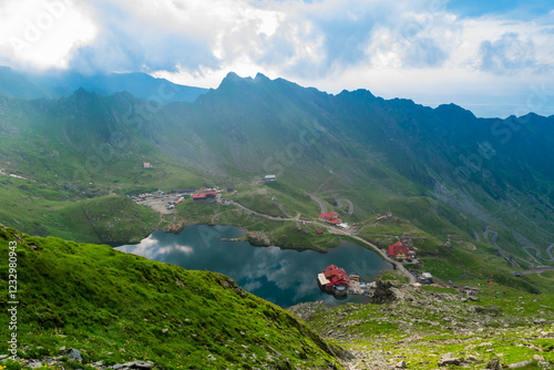 Chalets on shore Balea Lake is glacier lake in Fagaras Mountains. Transfagarasan mountains road, is one of the most beautiful roads in the world. Carpathians. Romania. photo