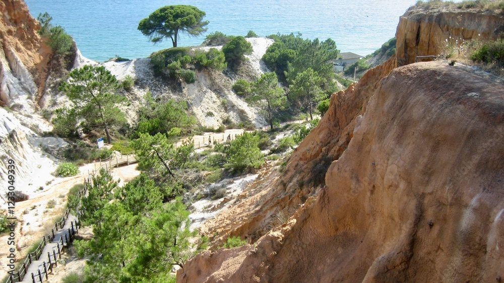 rocks in Portugal in Algarve, between them a path leading to the ocean rocks in Portugal in Algarve, between them a path leading to the ocean
