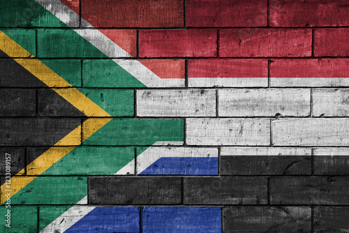 colourful painted big flag of south africa and flag of yemen on a massive old brick wall background. concept photo