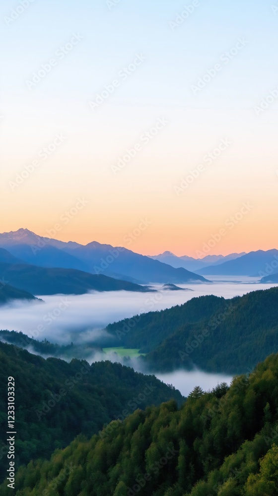 The mountains are covered in fog and the sky is a beautiful orange color. The scene is peaceful and serene, with the mountains in the background and the fog creating a sense of calm The mountains are covered in fog and the sky is a beautiful orange color. The scene is peaceful and serene, with the mountains in the background and the fog creating a sense of calm