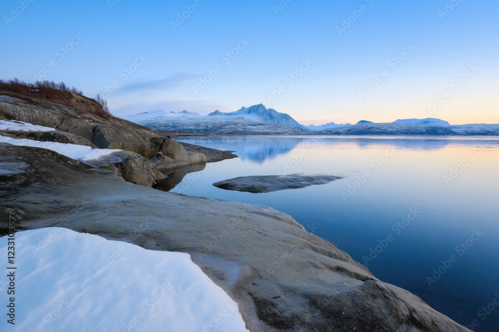 A beautiful view of a lake with mountains in the background. The sky is clear and the sun is setting, creating a serene and peaceful atmosphere A beautiful view of a lake with mountains in the background. The sky is clear and the sun is setting, creating a serene and peaceful atmosphere