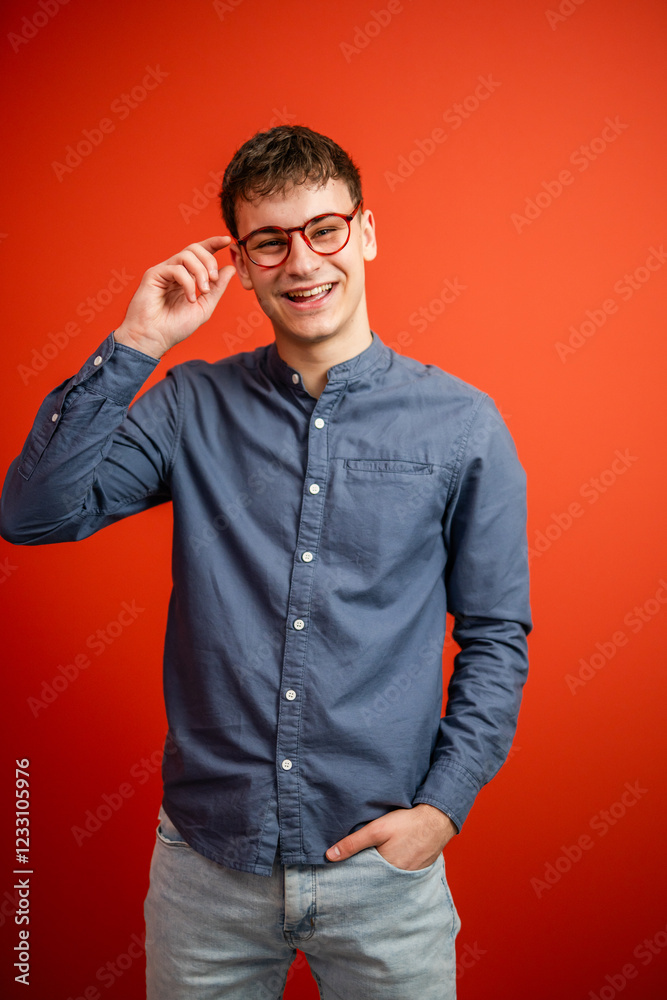 Fototapeta premium portrait of man stand in front red background studio shot