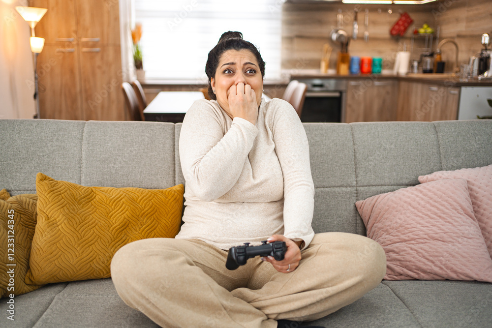 Obraz premium Woman having fun playing video games at home