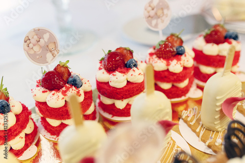 Red mini cream cake, sweet table, sweet snacks photo