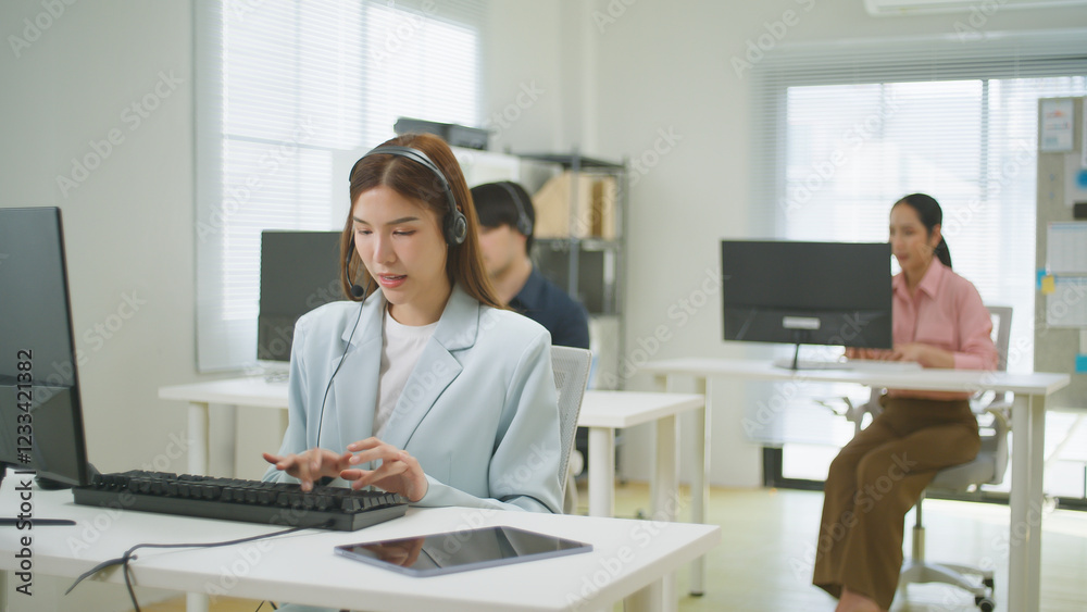 Smiling asian woman working as a customer support operator with headset. Female Call center, consulting and telemarketing concept, Customer service representative. sale agent Representative Company. Smiling asian woman working as a customer support operator with headset. Female Call center, consulting and telemarketing concept, Customer service representative. sale agent Representative Company.