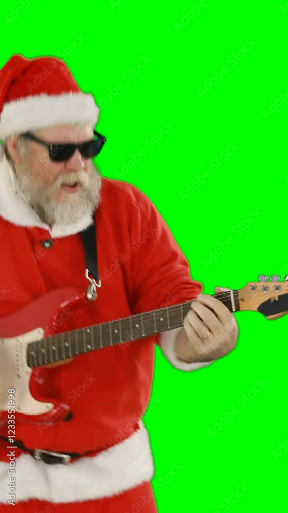 Santa claus singing a song and playing guitar Santa claus singing a song and playing guitar