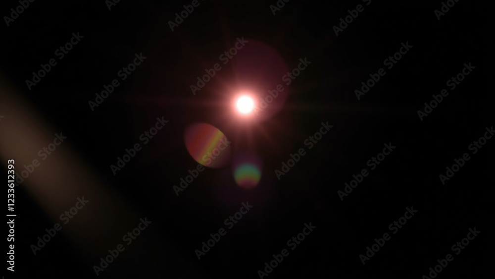 Abstract Lens Flare Overlay Glowing Light Burst with Rainbow Effects on Black Background Abstract Lens Flare Overlay Glowing Light Burst with Rainbow Effects on Black Background
