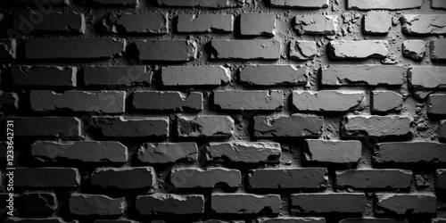 A striking medium-close-up of a black and white brick wall reveals an intricate staggered pattern; the topmost brick stands out boldly against its subtle counterparts below photo