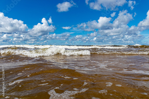 Fototapeta Naklejka Na Ścianę i Meble -  seascape, storm at sea, white waves crashing against the shore, Baltic Sea coast, Latvia