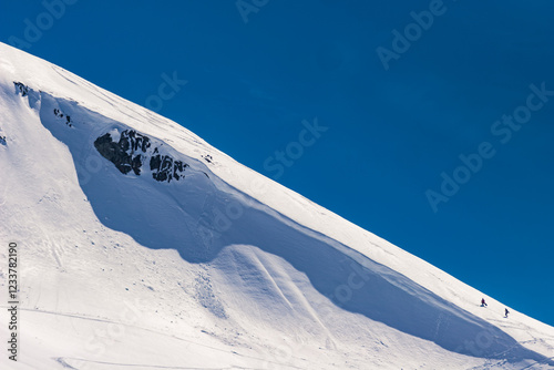 Hiking up the ridge of a cornice photo