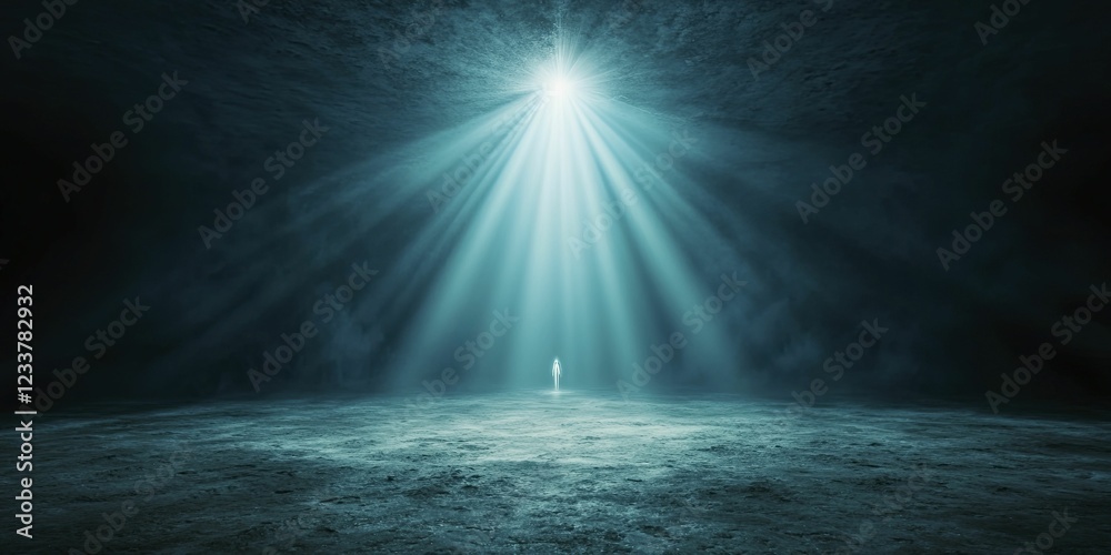A radiant beam of light shining down on a lone figure. A radiant beam of light shining down on a lone figure.
