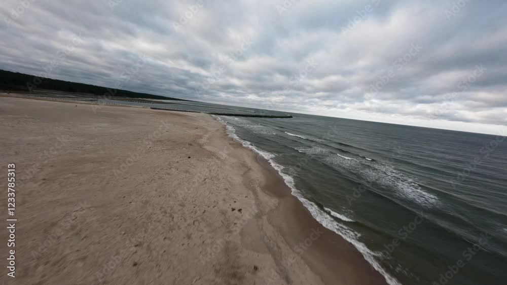 Aerial FPV fly empty beach at Baltic sea landscape in Krynica Morska, Poland Aerial FPV fly empty beach at Baltic sea landscape in Krynica Morska, Poland