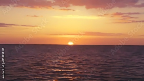 the sun is setting over a large body of water